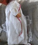 porcelain baby doll white gown side